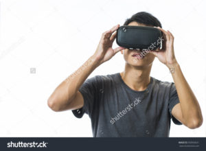stock photo man using the virtual reality headset 350950631 | EXIT NOW | Live Game Experience | Escape Room | Services